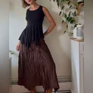 Plenty Asymmetrical Black Tank Top
Fits Small